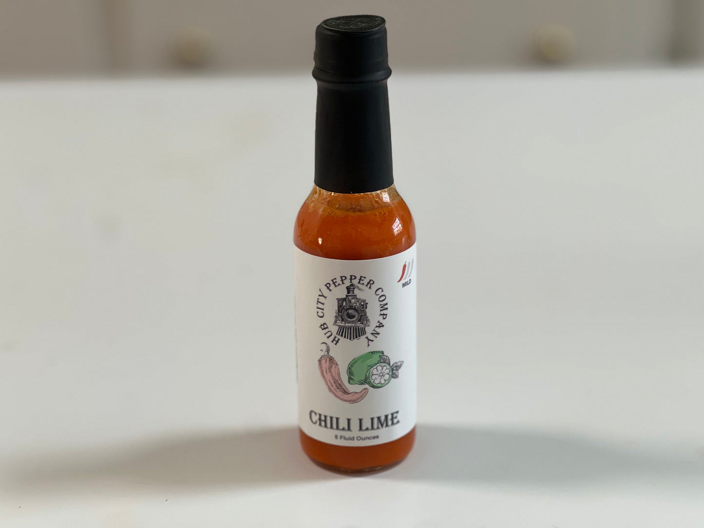 Chili Lime Hot Sauce. A tangy and spicy hot sauce. Ranged shot