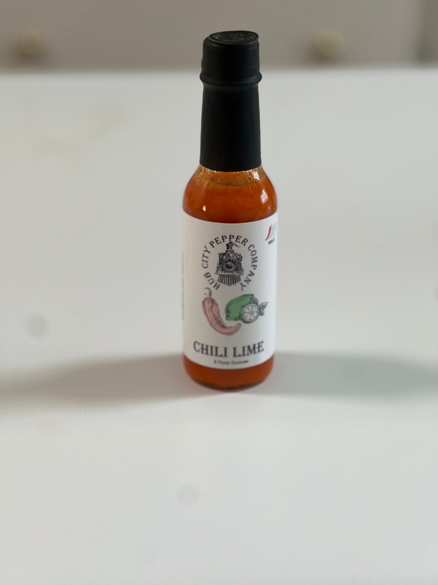 Chili Lime Hot Sauce. A tangy and spicy hot sauce. Up right placement of image.