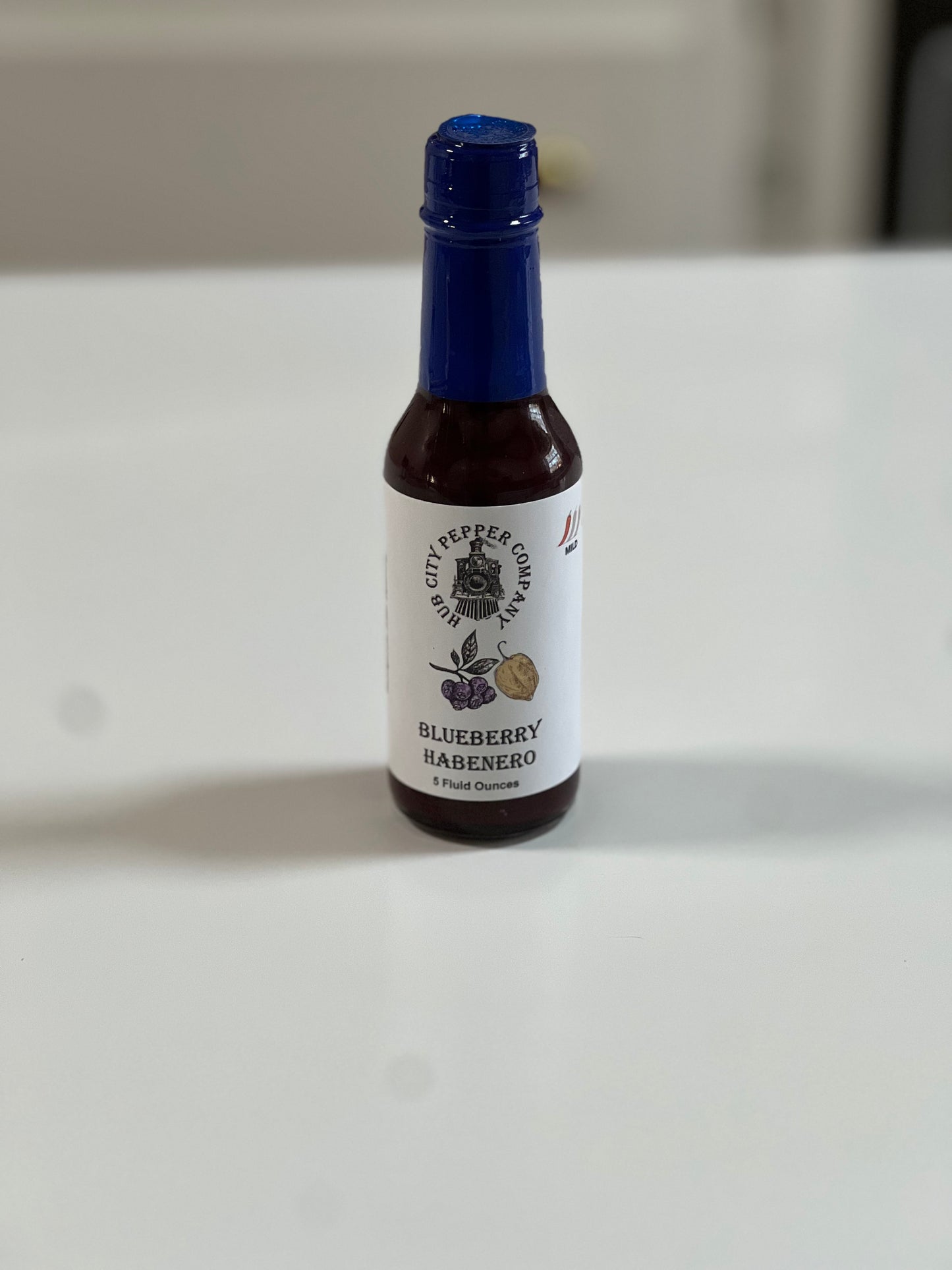 Blueberry Habanero Hot Sauce. perfect for dessert or put it on chicken. Sweet, Spicy and wonderful! Spaced shot.